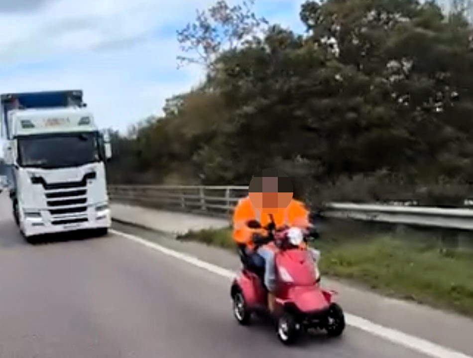 Drivers were stunned as an elderly man was spotted riding a mobility scooter on the A21 motorway in Kent - dashcam footage of the shocking moment has gone viral online.