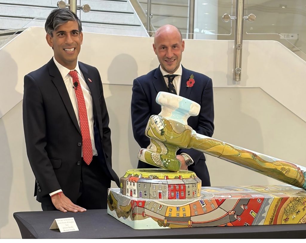 George with Rishi Sunak raising money for charity