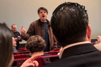 Opera performance of Carmen at the Met erupts in boos as protesters storm the stage targeting the Kochs sparking chaos before security removed them and the show resumed after delays.