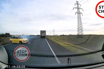 A BMWs risky overtake nearly caused a head on crash in Poland as dashcam footage shows a yellow Seat skidding to avoid impact before chasing the driver in a dramatic near miss.