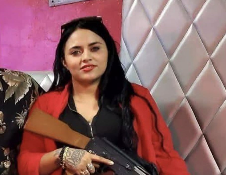A feared Gulf Cartel hitwoman known as La Chucky was killed in a shootout with police in Mexico - five people died as officers seized guns, vests and ammunition.