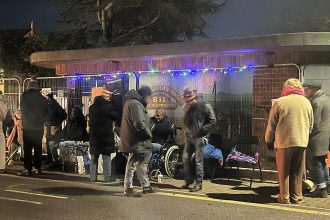 Residents camp out in a rare 1950s art deco bus shelter in Sheringham to stop demolition with campaigners vowing to protect the historic site despite council plans for a new travel hub.