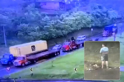 Parents killed as lorry smashes into family car during traffic jam while son was roadside peeing brothers survive Colombia crash now under investigation for brake failure.