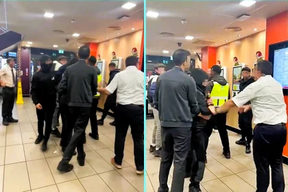 Brave McDonalds worker confronts violent youths during chaotic attack in north London branch, shielding himself as bottles were thrown and earning praise for standing his ground.