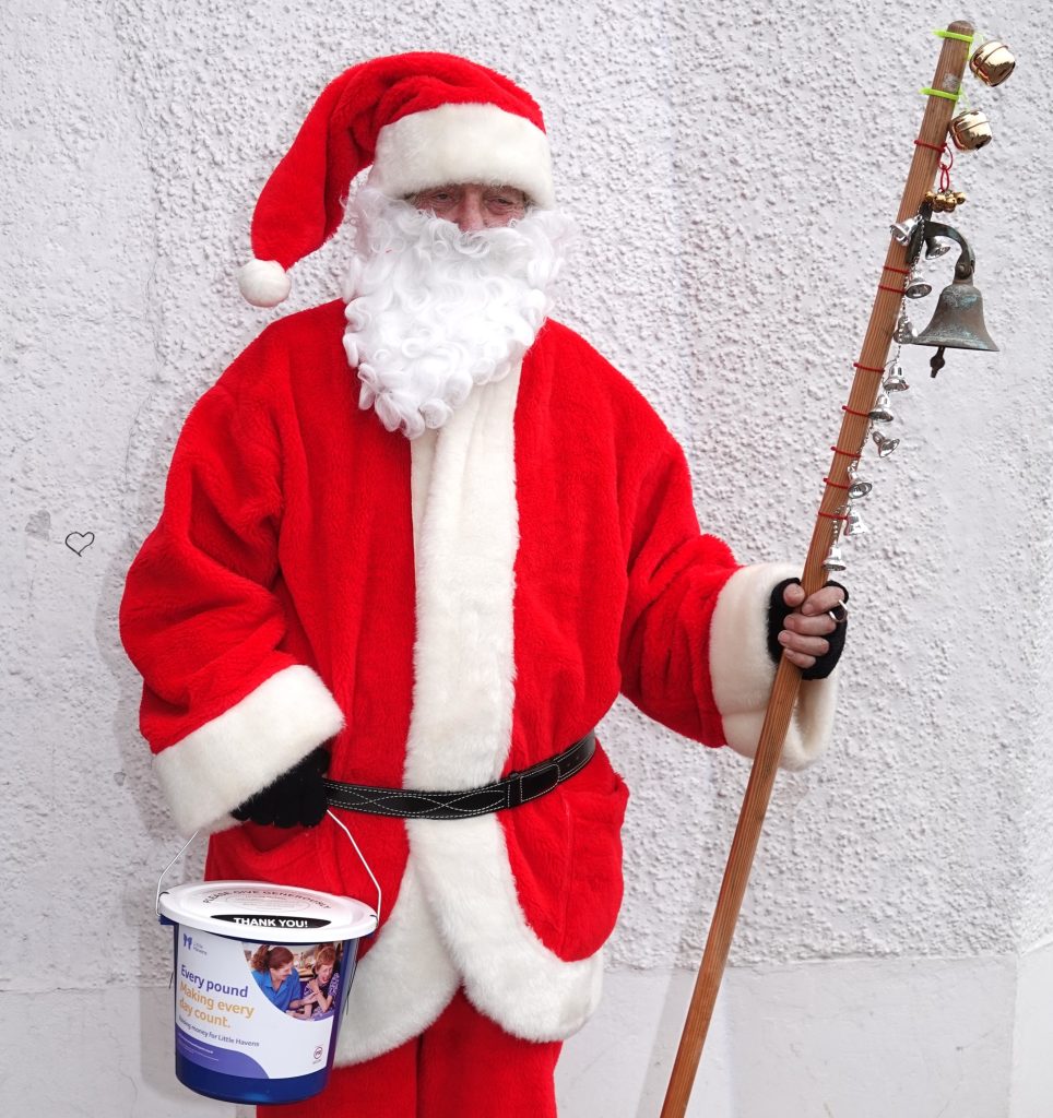 Pensioner dressed as Santa claims Lidl staff called police and branded him a scammer while he collected for hospice charity outside store leaving him distressed but determined.