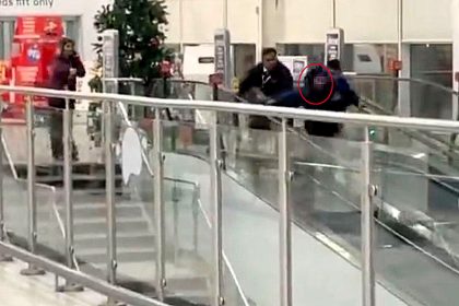 Christmas shopping chaos as customer forcibly removed from Sainsburys in Slough dragged down moving walkway by staff shocking shoppers and sparking viral reactions online.