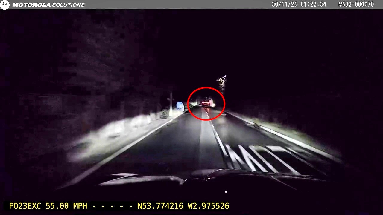 Disqualified Jaguar driver charged after 100mph police chase in Lytham St Annes blowing over twice the drink drive limit as shocking footage shows him swerving across the road.
