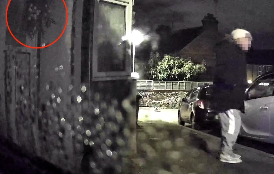 Family left stunned as Grinch like thief steals Christmas wreath during festive film night ripping it from front door on CCTV sparking shock anger and disbelief at heartless act.