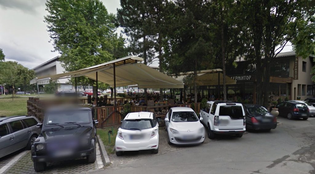 Partizan Belgrade ultra Nenad Alajbegovic survives a tenth assassination attempt after a restaurant shooting in Belgrade as the hunt for the hooded gunman continues amid ongoing conflict.