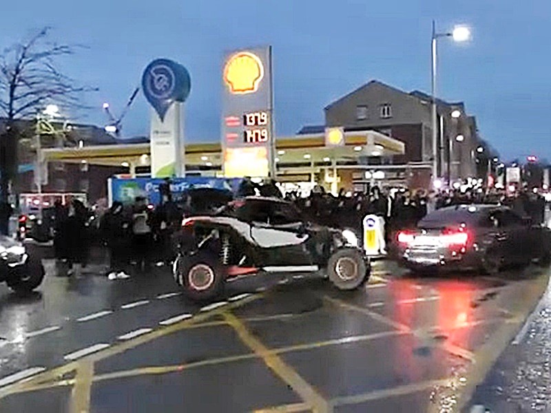 Illegal car meet brings Manchester traffic to a standstill as hundreds gather for donuts and burnouts in live traffic before police shut down the dangerous scenes.
