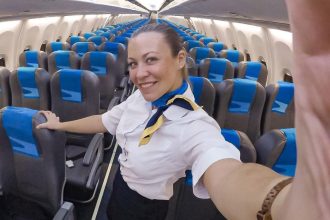 Flight attendant reveals surprising uniform rules including bans on PDA smoking gum and drinking coffee at the gate plus secret tricks used to manage onboard water requests.