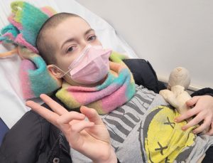 Young woman learns she has rare bone cancer after reading tumour results on NHS app- a shocking diagnosis that changed her life and fuels calls for patient communication.