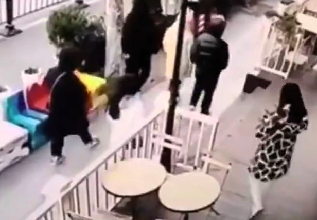 Woman who broke her back after tripping while staring at her phone loses lawsuit as court rules restaurant not to blame for shocking fall caught on CCTV.