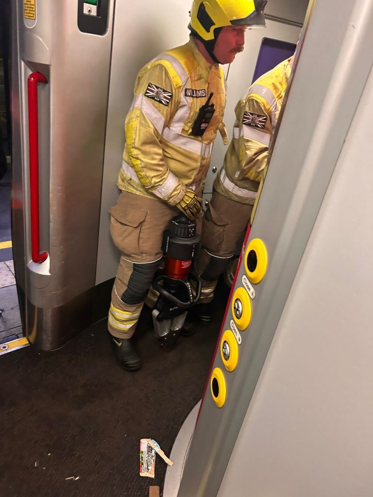 Severely claustrophobic Robin Smith trapped in train toilet for nearly 2 hours. Firefighters cut through door to rescue her after she almost fainted twice.