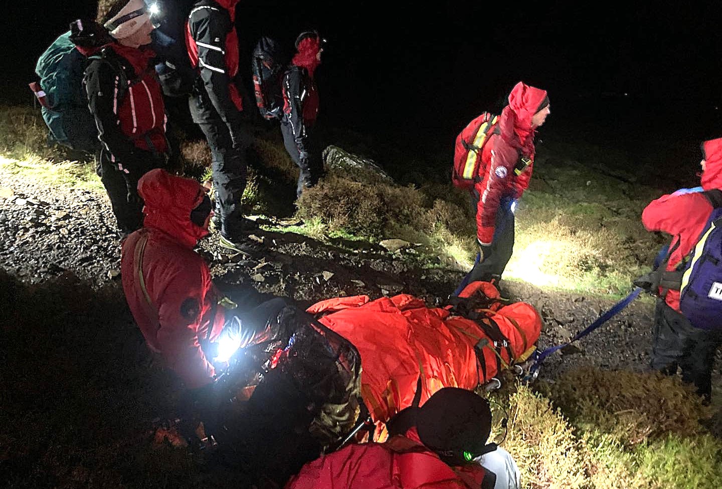 Over 30 rescuers battle nearly 6 hours to save woman with dislocated ankle from Skiddaw peak in Lake District darkness and gales. 36 team members involved.