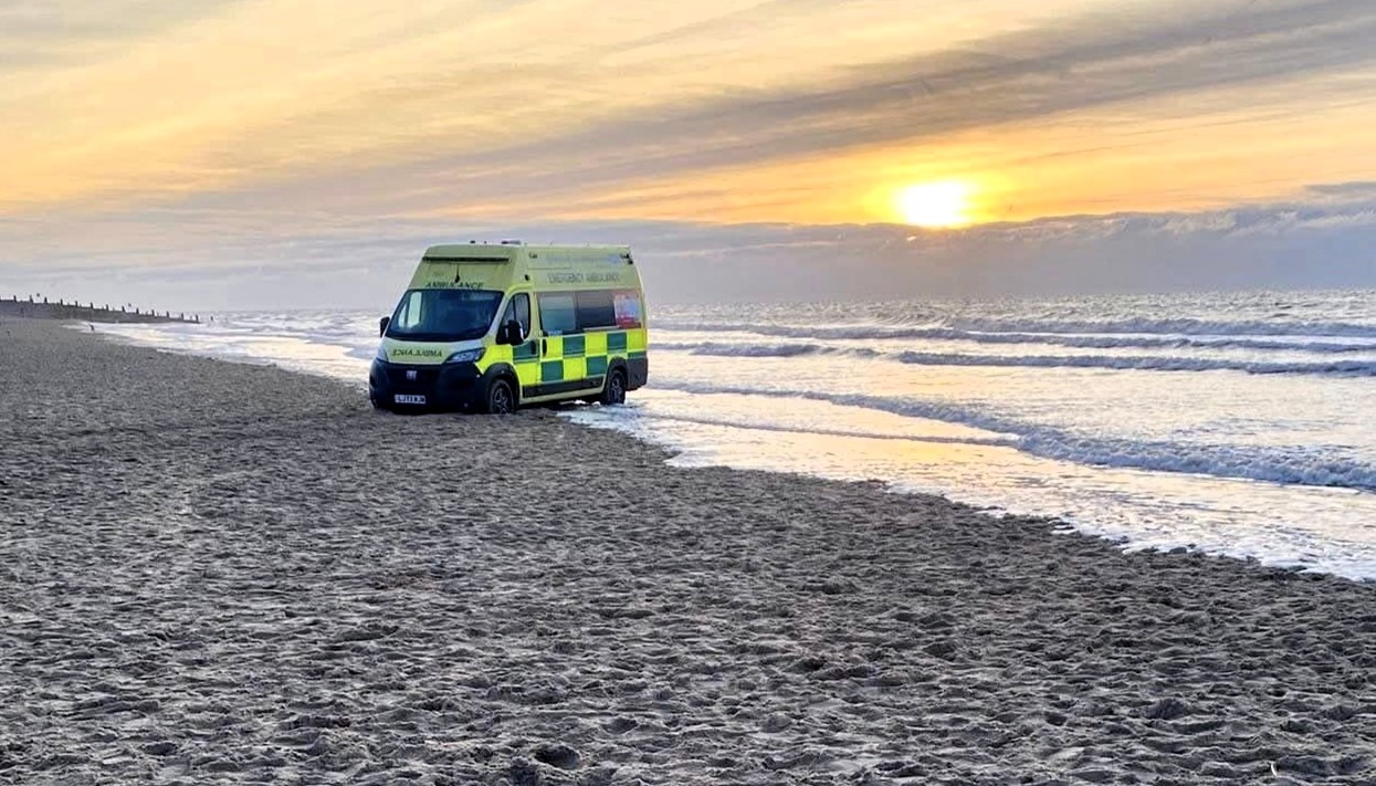 Ambulance with patient inside trapped by rising tide at Camber Sands beach on New Year's Day required off-road recovery vehicle rescue as waves reached its wheels.