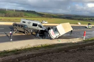 Three-ton removal lorry blown onto its side by powerful gusts while parked on the A30 in Cornwall, dramatic dashcam footage shows crew watching helplessly as winds strike.