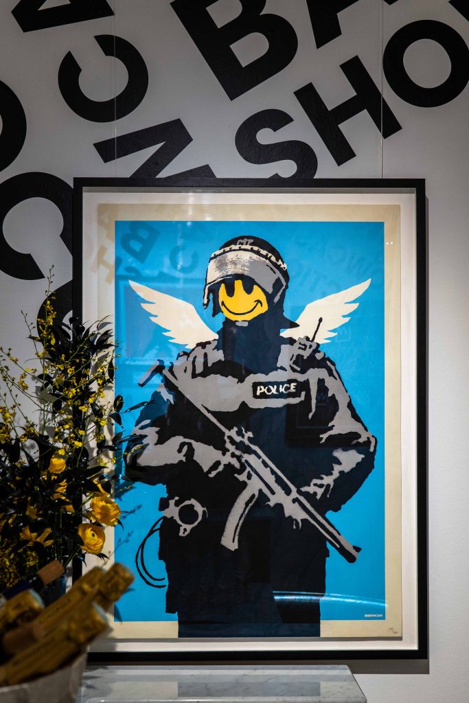 Collection of 13 Banksy prints including iconic Girl with Balloon set to raise £300,000 at Heritage Auctions. Features Basquiat tribute and Pulp Fiction banana piece.