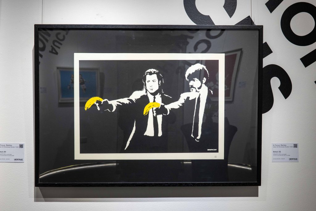 Collection of 13 Banksy prints including iconic Girl with Balloon set to raise £300,000 at Heritage Auctions. Features Basquiat tribute and Pulp Fiction banana piece.