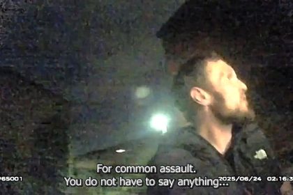 Thug Terry O'Sullivan jailed 27 weeks after headbutting police officer and breaking his nose during arrest - also hurled 15 minutes of racist abuse at officers.