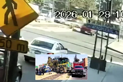 Driver miraculously survives after train slams into his car at level crossing and drags it metres along track - trapped in crumpled wreck between train and poles.