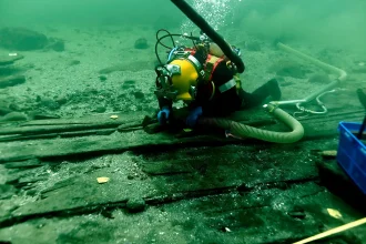 Largest medieval cargo ship ever found - 92ft cog discovered 40ft underwater off Copenhagen. Well-preserved 1410 vessel with crew quarters, galley and artifacts.
