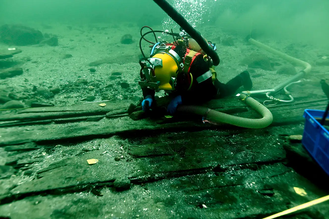 Largest medieval cargo ship ever found - 92ft cog discovered 40ft underwater off Copenhagen. Well-preserved 1410 vessel with crew quarters, galley and artifacts.