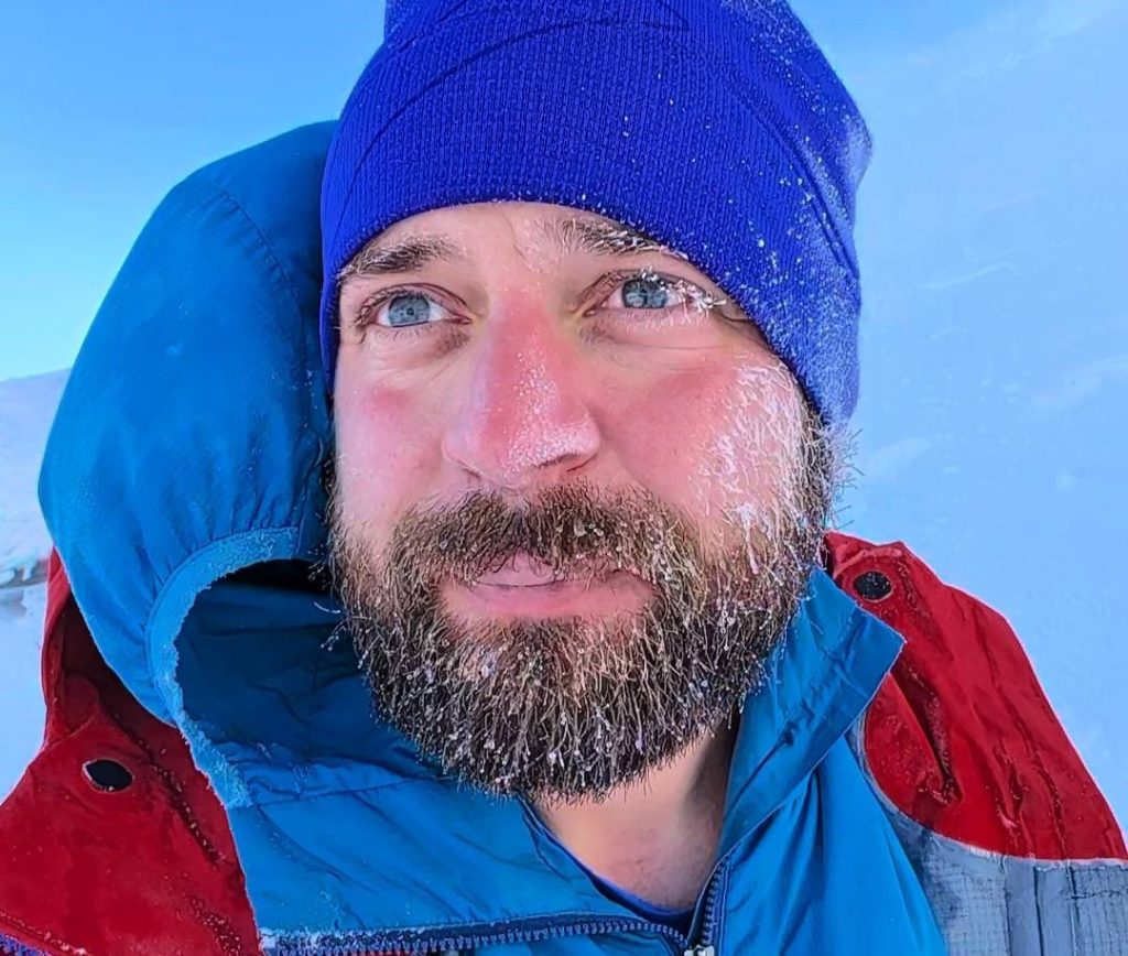 A climber attempting to walk Scotland's entire 750-mile watershed in winter shattered his ankle on the final mountain - and waited six hours in the dark before volunteer rescuers carried him to safety.