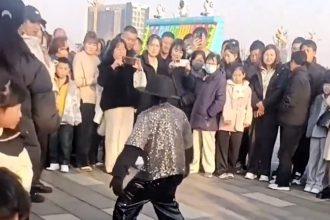 A Michael Jackson-inspired dancing robot stole the show for all the wrong reasons after malfunctioning mid-routine in China - flailing wildly, face-planting, and kicking a staff member in the face.