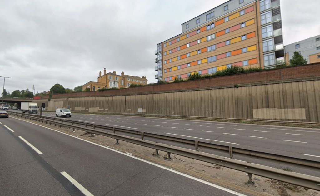 Man on 5mph scooter spotted riding down 50mph A406 North Circular near South Woodford as cars zoom past. Shocking footage shows minimal protective gear. Viral video.