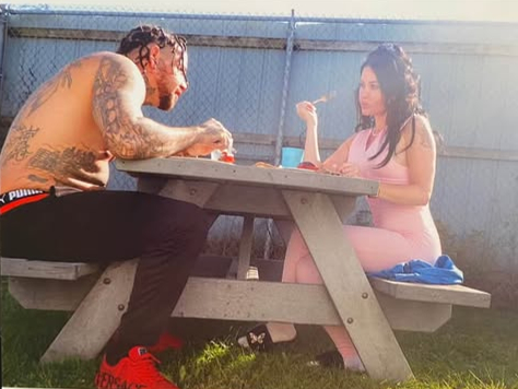 Woman married to man serving life sentence celebrates Valentine's with overnight prison visits where he cooks lobster and bakes cookies. Couple expecting first child.