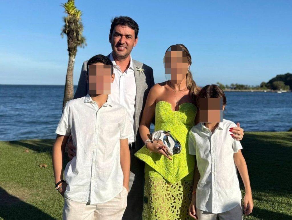 Senior official allegedly shot his two sons after private detective filmed wife kissing another man. The 12-year-old died and his brother is critical in Brazil.