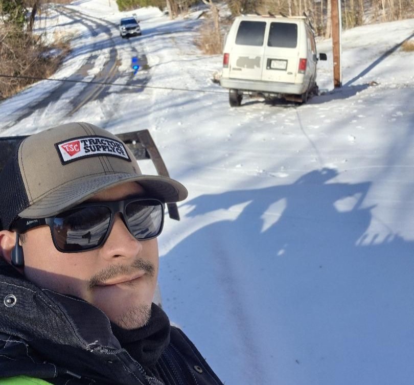 Tow truck driver plunges 10 feet down drain hidden by snow during call-out in North Carolina. Diego Burgos' bodycam captures shocking fall that left him dizzy.
