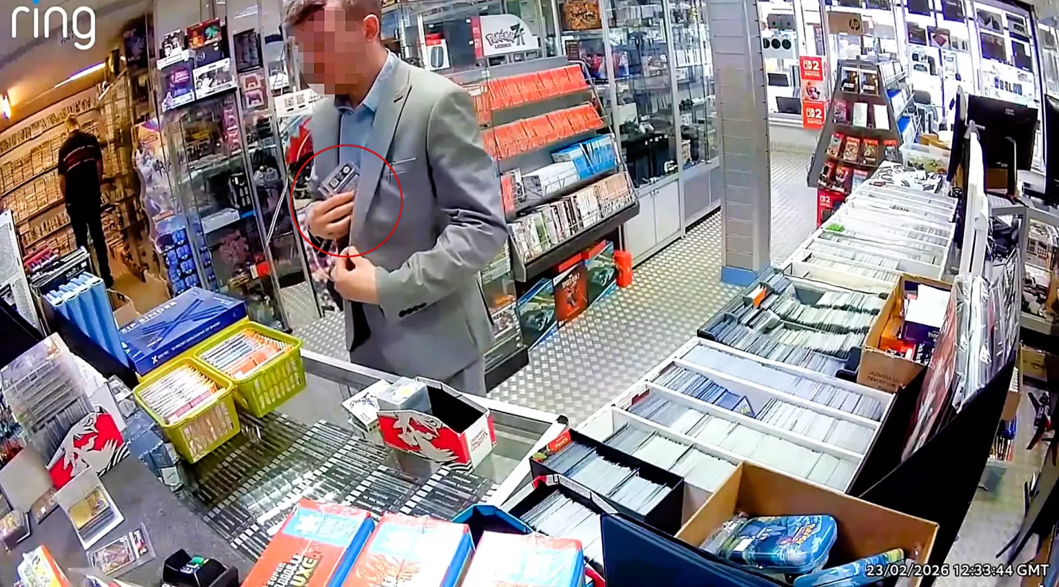 Smartly-dressed shoplifter caught on camera casually pocketing over £300 worth of Pokemon cards from a shop in Hinckley - owner says they "thought they were Team Rocket".