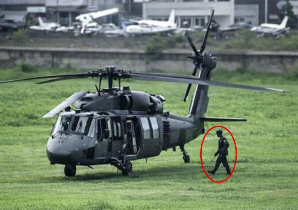 Colombian soldier struck by lightning collapses flat while guarding Black Hawk helicopter at military base. He's now stable and recovering. Chopper critically damaged.