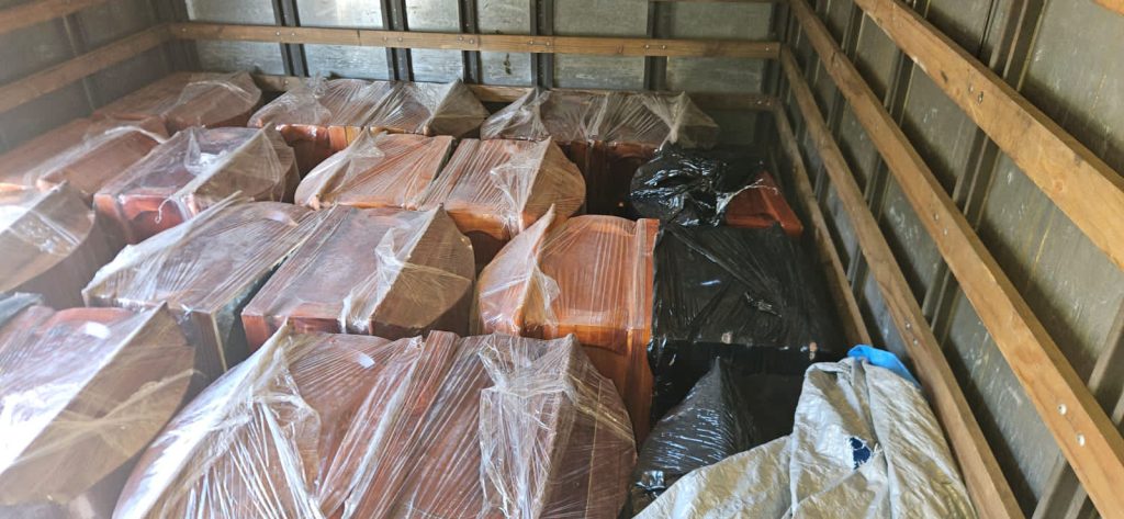 Police seize cannabis hidden inside a coffin after stopping a lorry carrying 23 caskets in Chile - three suspected drug traffickers arrested during routine roadside checks.