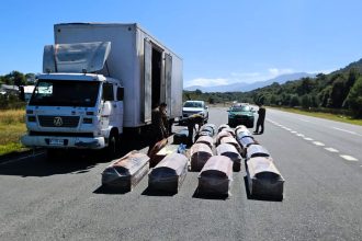Police seize cannabis hidden inside a coffin after stopping a lorry carrying 23 caskets in Chile - three suspected drug traffickers arrested during routine roadside checks.