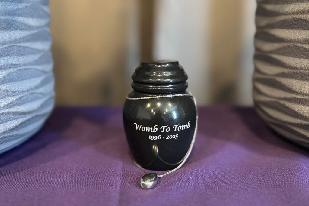 A mum's organs collapsed and crushed her uterus six months after giving birth - she then had it cremated and now keeps the ashes in an urn engraved with "Womb to Tomb".