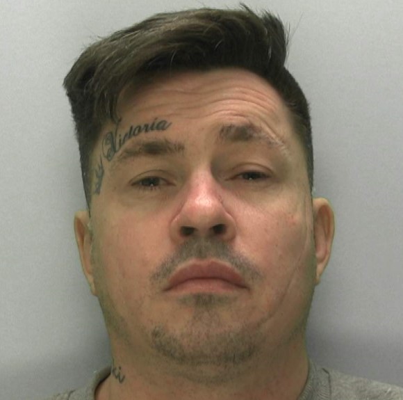 A cop slammed online for punching a detained man has been cleared after bodycam footage revealed the suspect was biting his leg hard enough to pierce the skin.