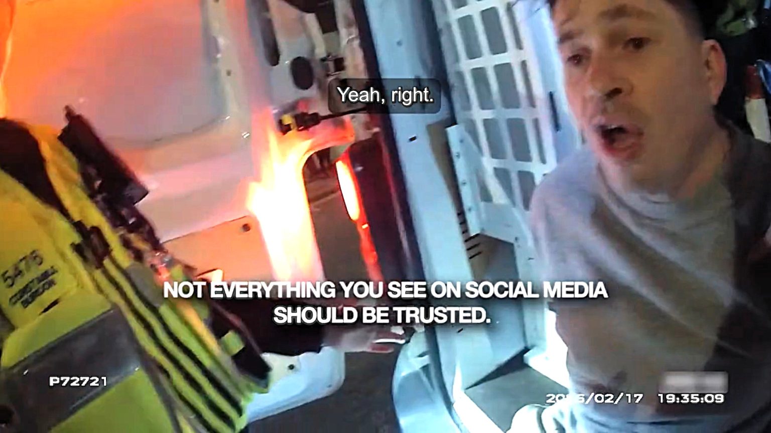 A cop slammed online for punching a detained man has been cleared after bodycam footage revealed the suspect was biting his leg hard enough to pierce the skin.