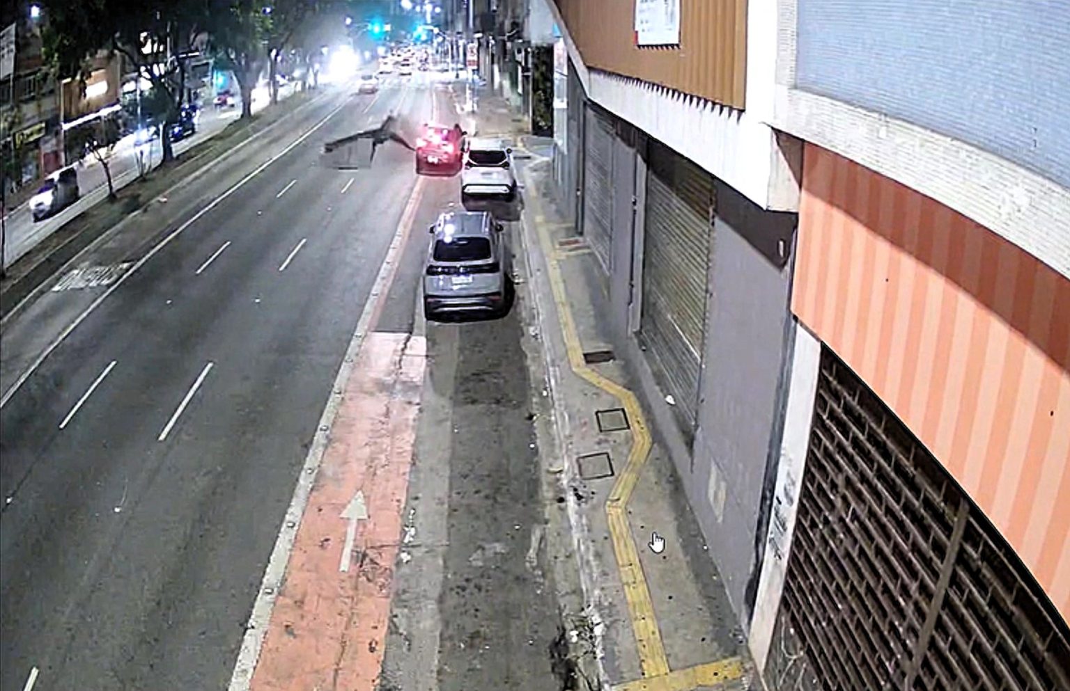 A driver had a lucky escape when a pothole exploded just inches from their car on a main road in Sao Paulo - sending debris flying in a scene resembling a volcanic eruption.