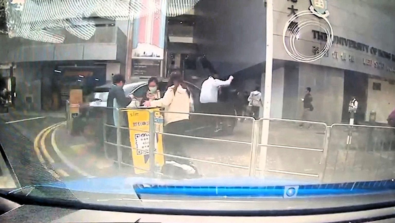 An elderly driver ploughed into a crowd of tourists in Hong Kong after reportedly mixing up the pedals - nine people were injured including eight pedestrians on the street.