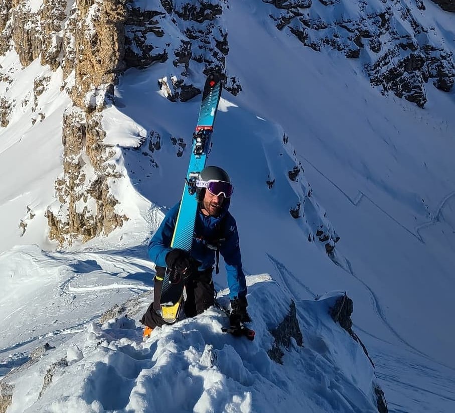An extreme sports enthusiast has died after being buried in a massive avalanche while skiing off-piste, as rescuers raced against time in a desperate search effort