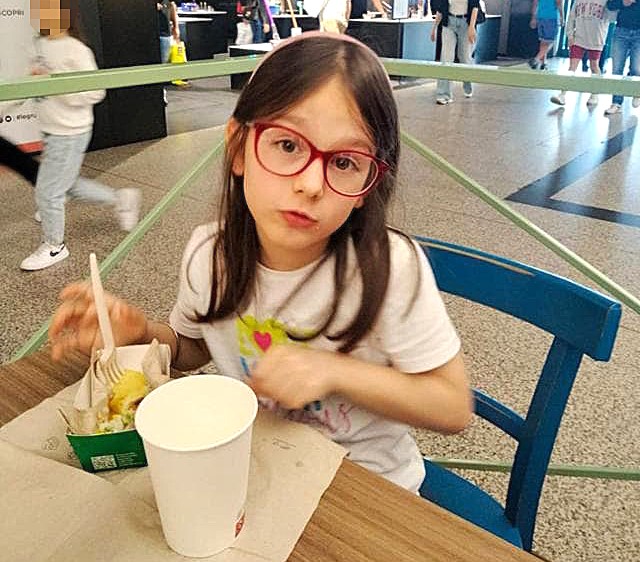 A seven-year-old girl drowned at a summer camp after being given the wrong wristband allowing her into deep water - now six people face trial for manslaughter over her death.
