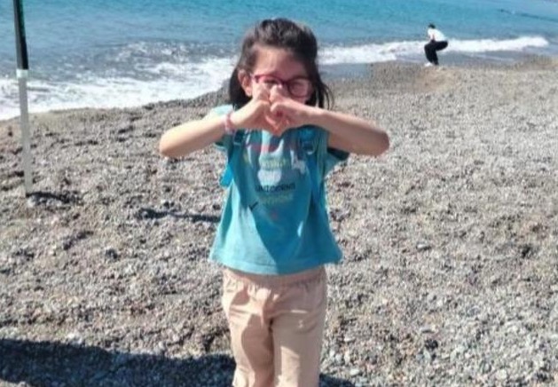 A seven-year-old girl drowned at a summer camp after being given the wrong wristband allowing her into deep water - now six people face trial for manslaughter over her death.