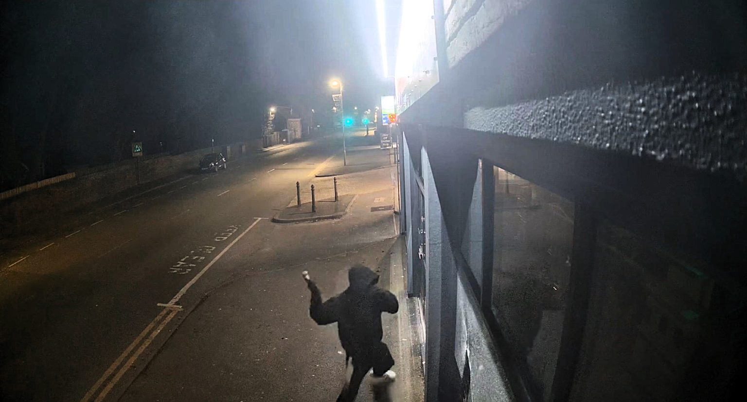 A hammer-wielding vandal caused £40,000 in damage after smashing shop and funeral home windows in a late-night rampage, with the shocking destruction caught on camera