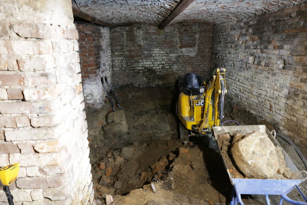 A hidden cache of World War-era weapons is discovered in a museum basement, prompting a major investigation as experts uncover decades-old firearms and live ammunition
