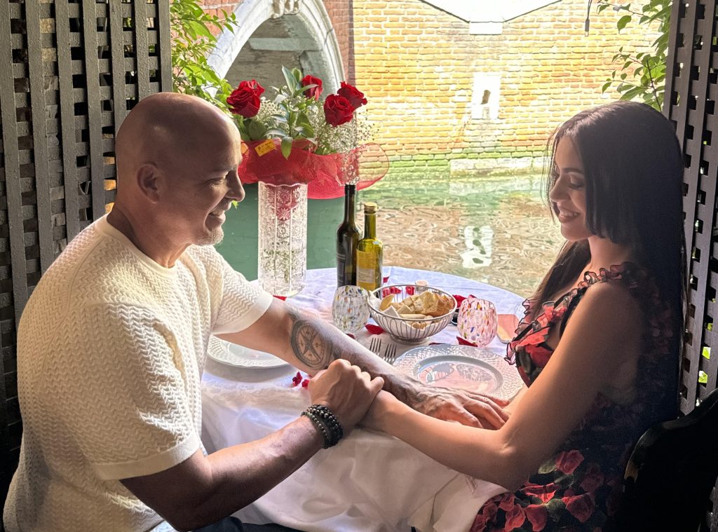 Christine, 34, and Eduardo, 59, met on a dating app and faced cruel insults over their 25-year age gap - but their love story is inspiring thousands to embrace love without shame.