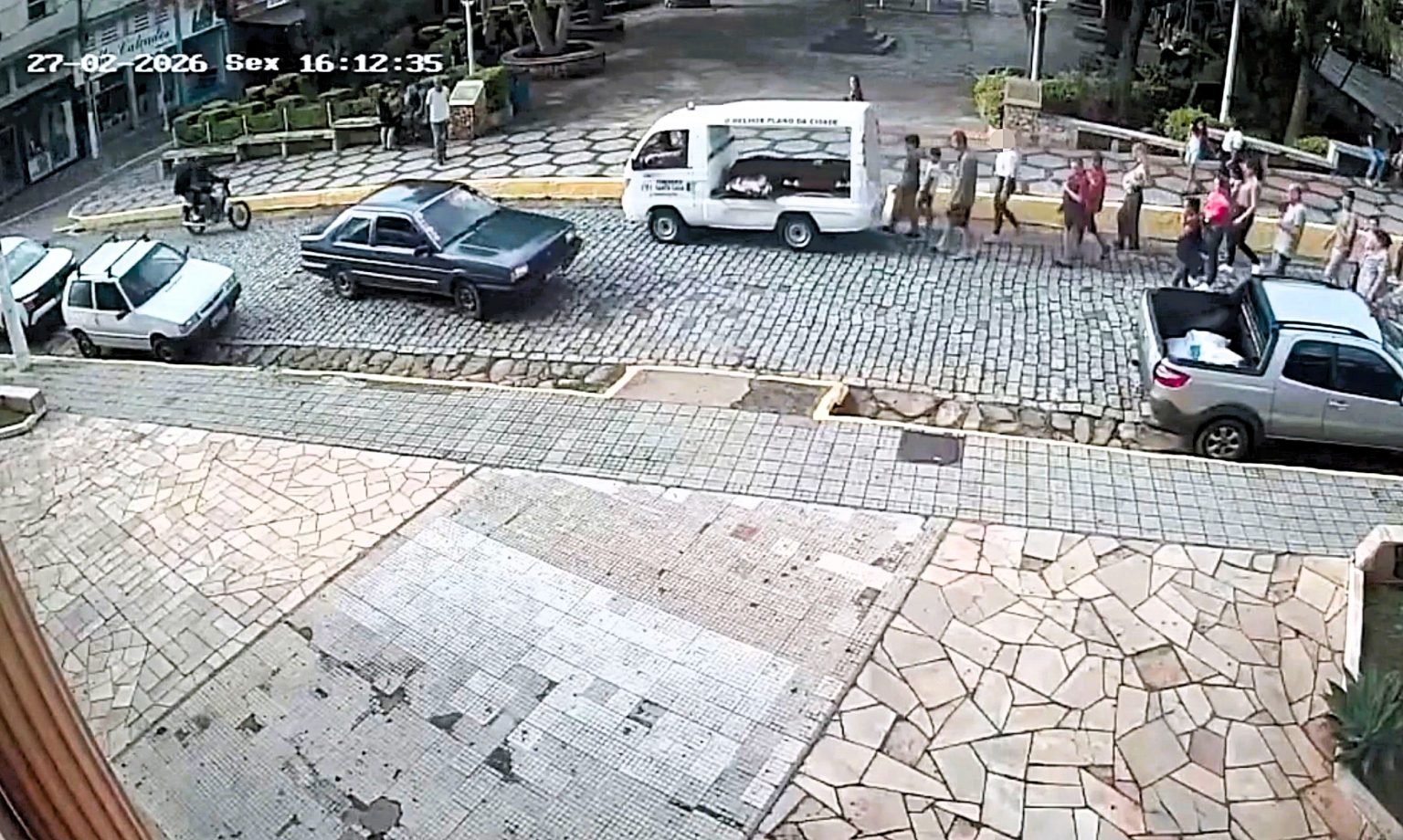 Woman shot three times at her own mother's funeral as gunman on motorcycle opened fire at point-blank range during the procession - a bullet even pierced the coffin in Brazil.