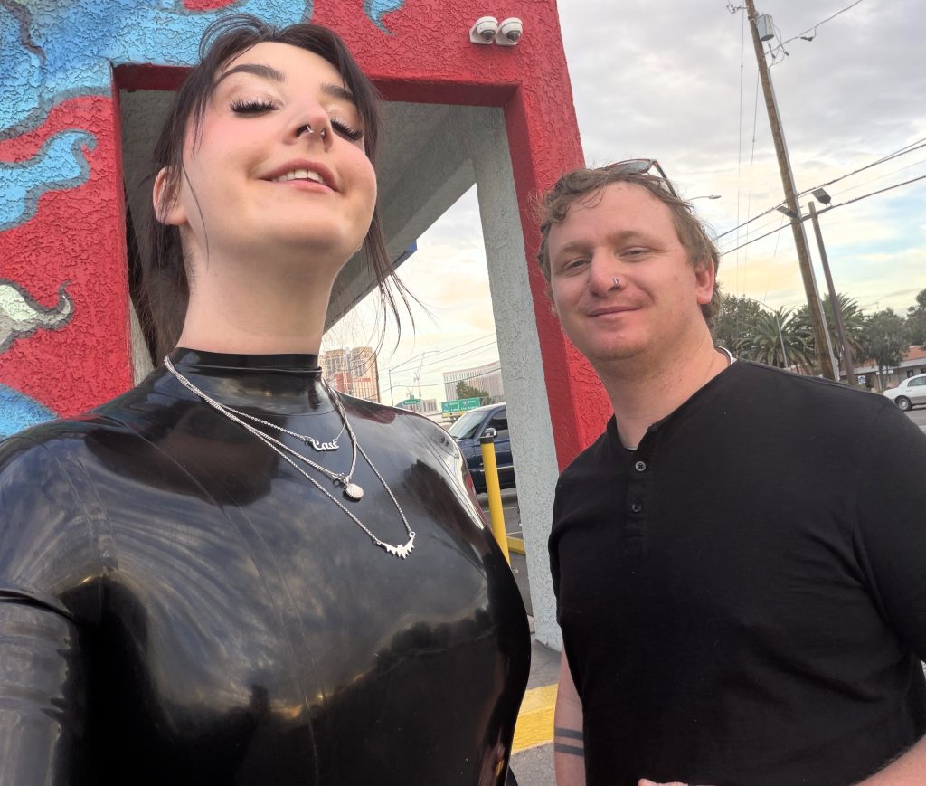 Woman reveals unusual relationship where boyfriend sleeps in a cage, wears a collar and gets paid a wage to serve her - the couple say communication is key to happiness.